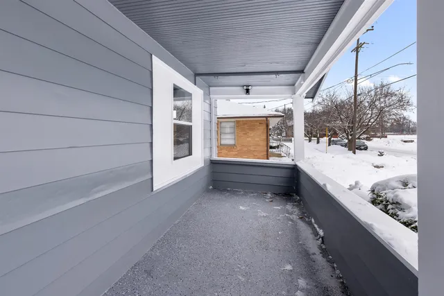 a view of room with stairs and wooden floor