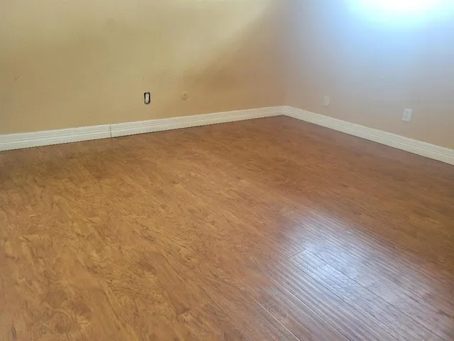 a view of an empty room with stairs