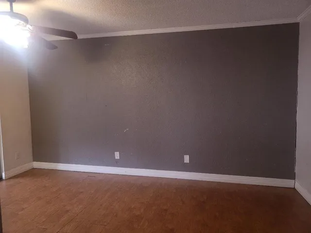 a kitchen with a sink and a refrigerator