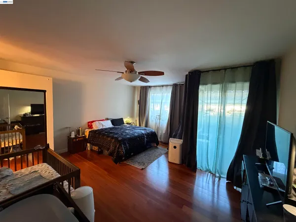 a bedroom with furniture and a window
