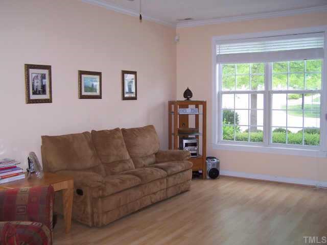 811 Rothshire Court, Unit 811 Raleigh, NC 27615 - Photo 2 of 7 a living room with furniture and a window