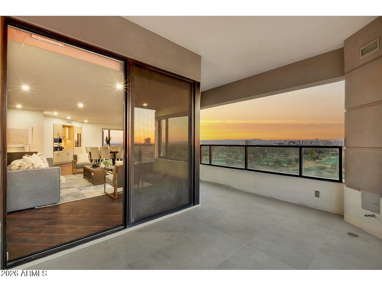 1040 East Osborn Road, Unit 1004 Phoenix, AZ 85014 - Photo 13 of 94 a view of a living room and floor to ceiling window