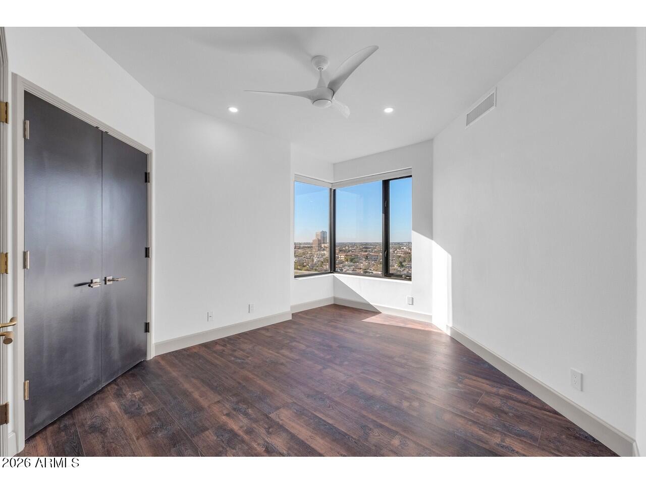 1040 East Osborn Road, Unit 1004 Phoenix, AZ 85014 - Photo 25 of 94 a view of an empty room with a window
