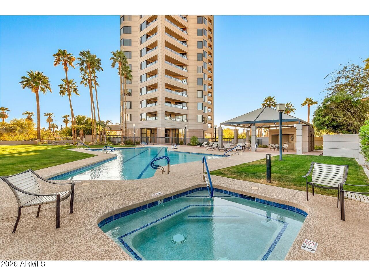 1040 East Osborn Road, Unit 1004 Phoenix, AZ 85014 - Photo 65 of 94 a view of a house with a yard and sitting area