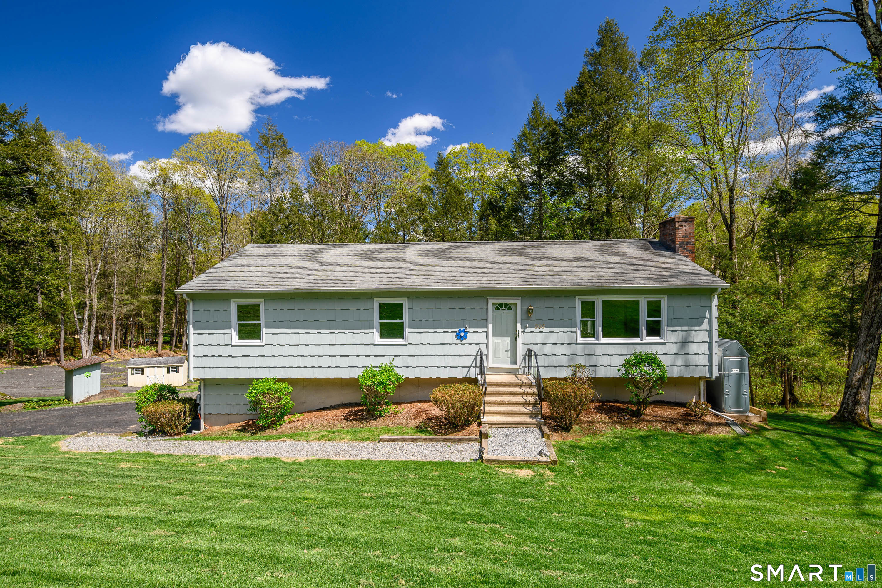 202 Grasslands Road Southbury, CT 06488 - Photo 1 of 1 Welcoming front entry with classic curb appeal, mature landscaping, and charming symmetry.