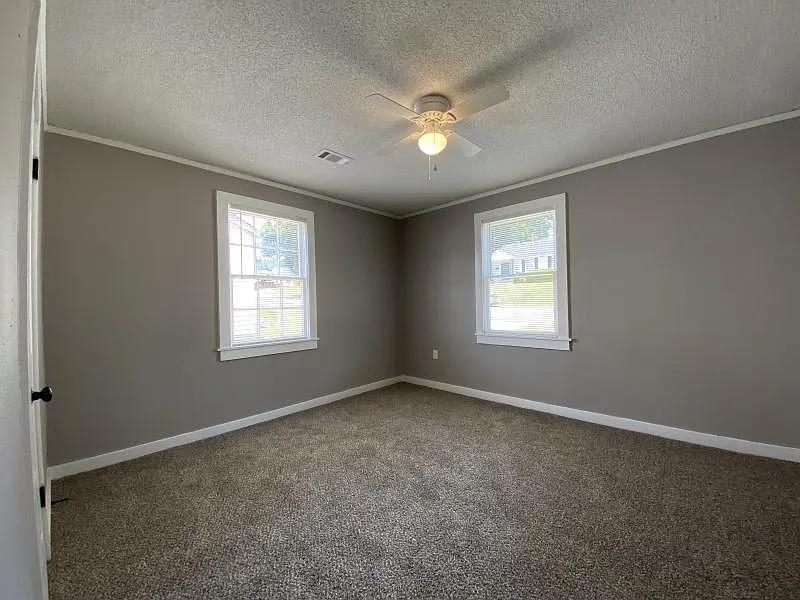 247 Modder Avenue Memphis, TN 38109 - Photo 6 of 9 a view of an empty room with a window
