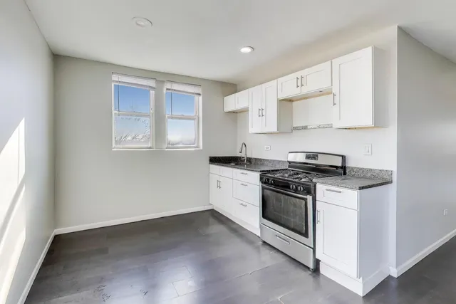 a kitchen with a stove and a microwave