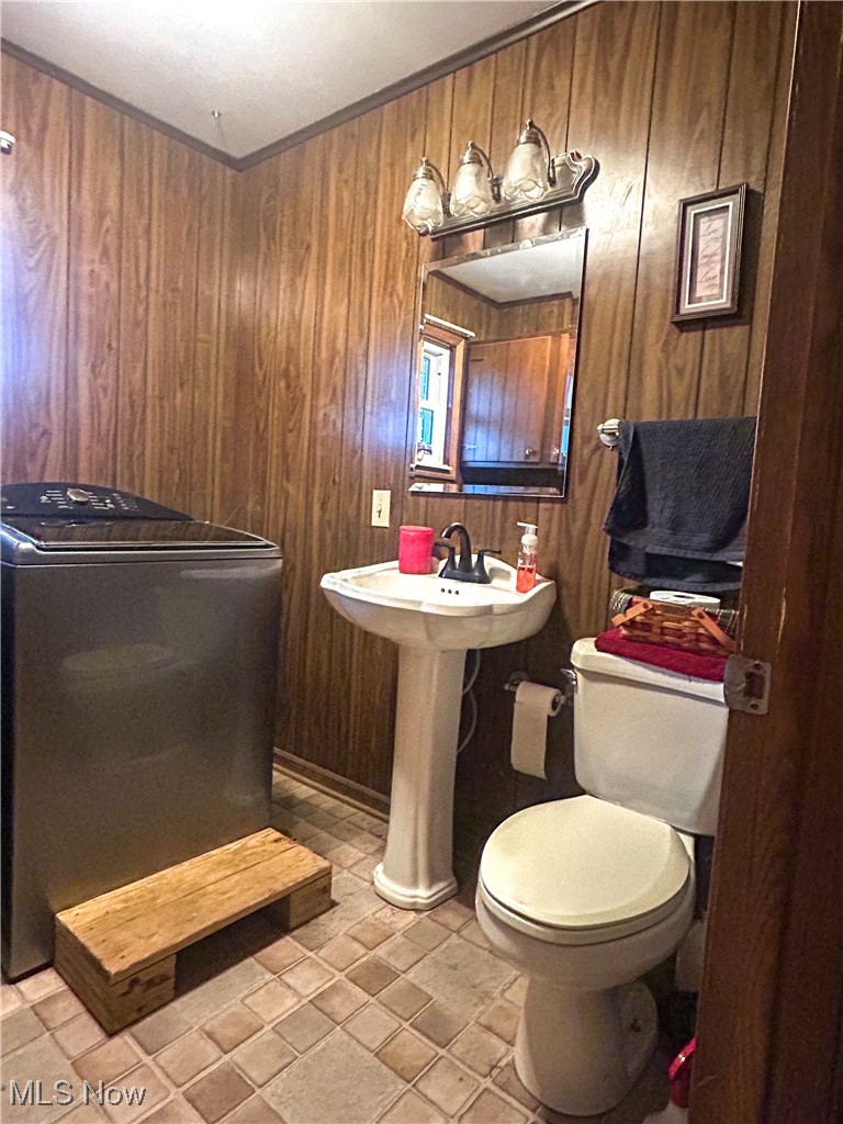 2242 South McCoy Ridge Road Stockport, OH 43787 - Photo 10 of 41 Half bath featuring wooden walls and ornamental molding