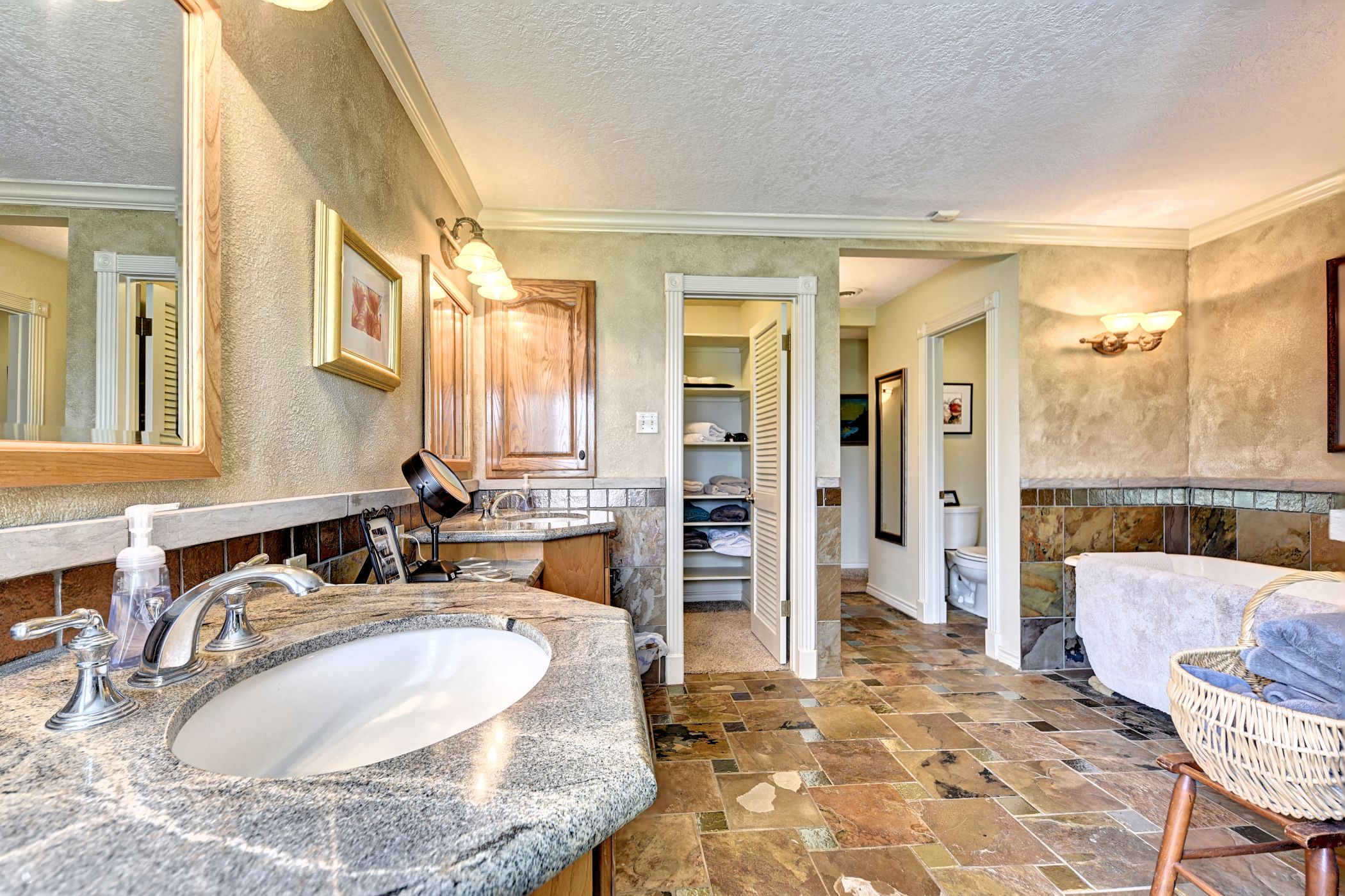 2575 Old Mill Creek Road Brenham, TX 77833 - Photo 19 of 40 a bathroom with a tub sink and mirror