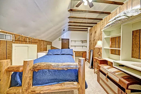a bedroom with furniture and a window
