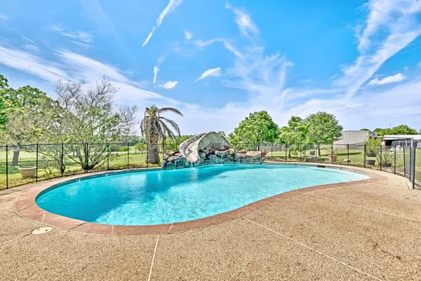 a view of outdoor space and swimming pool