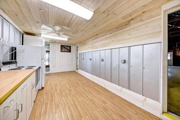 a view of a hallway with a wooden floor