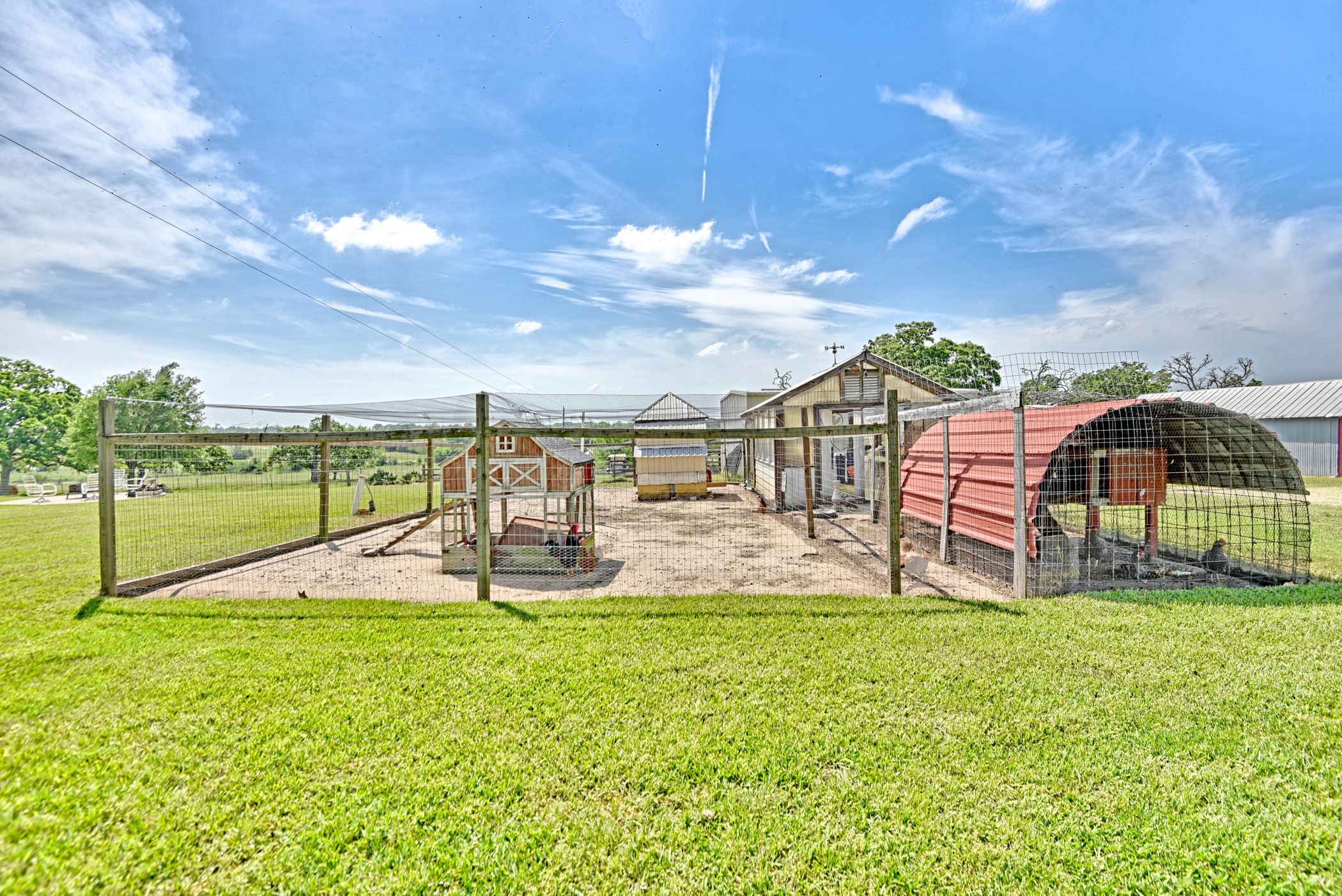 2575 Old Mill Creek Road Brenham, TX 77833 - Photo 39 of 40 a view of a swimming pool with an outdoor seating and house in the background