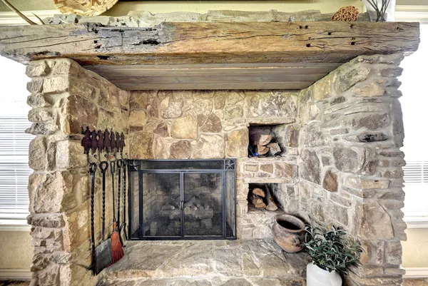 a room with fireplace and wooden floor