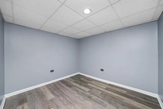 a view of a room with wooden floor and small space