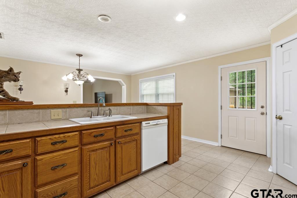 448 North Hill Road Tyler, TX 75706 - Photo 10 of 30 a bathroom with a granite countertop sink and a mirror