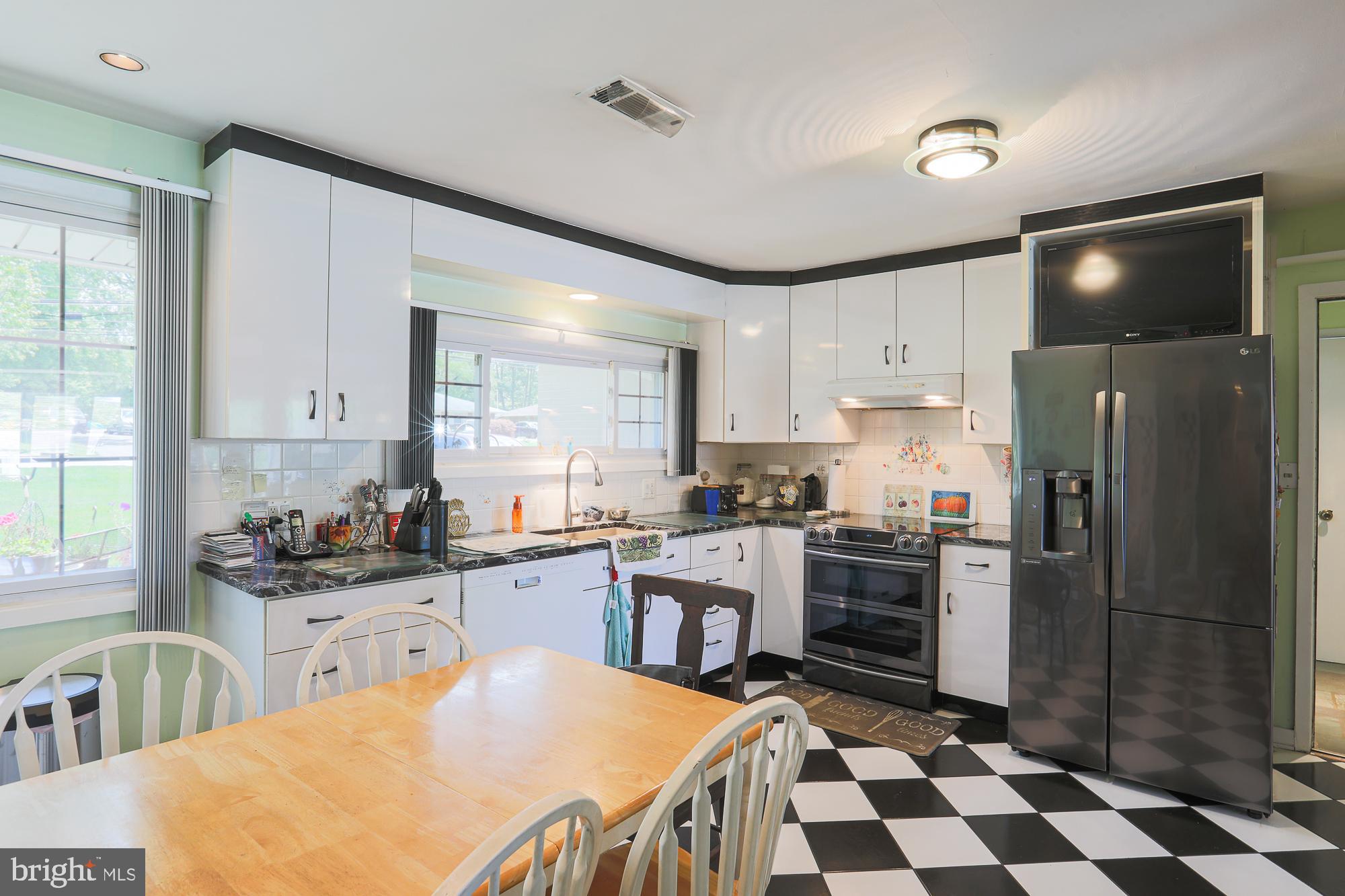 7940 Stevenson Road Pikesville, MD 21208 - Photo 7 of 55 White cabinets, granite counters, tile floor