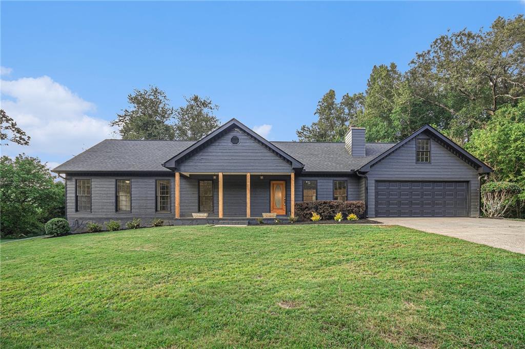 1139 Lower Union Hill Road Canton, GA 30115 - Photo 1 of 1 a front view of a house with a yard