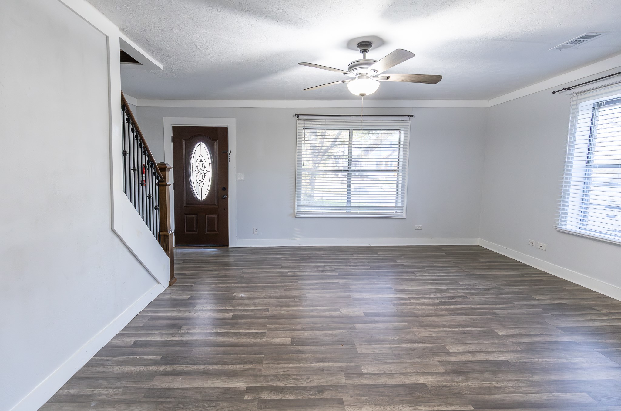 1425 15th Street Huntsville, TX 77340 - Photo 17 of 50 wooden floor in an empty room with a window