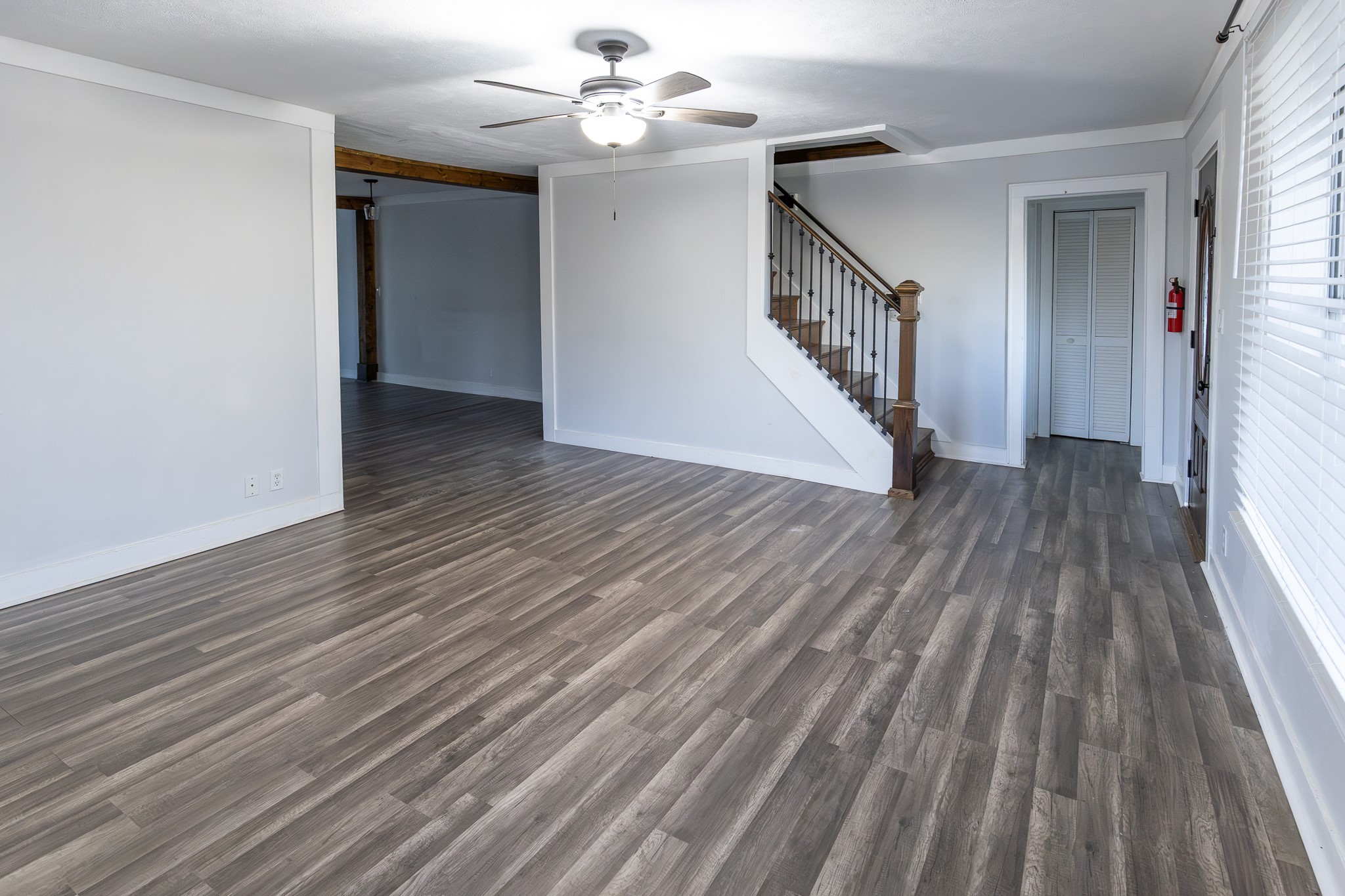 1425 15th Street Huntsville, TX 77340 - Photo 18 of 50 wooden floor in an empty room with a window