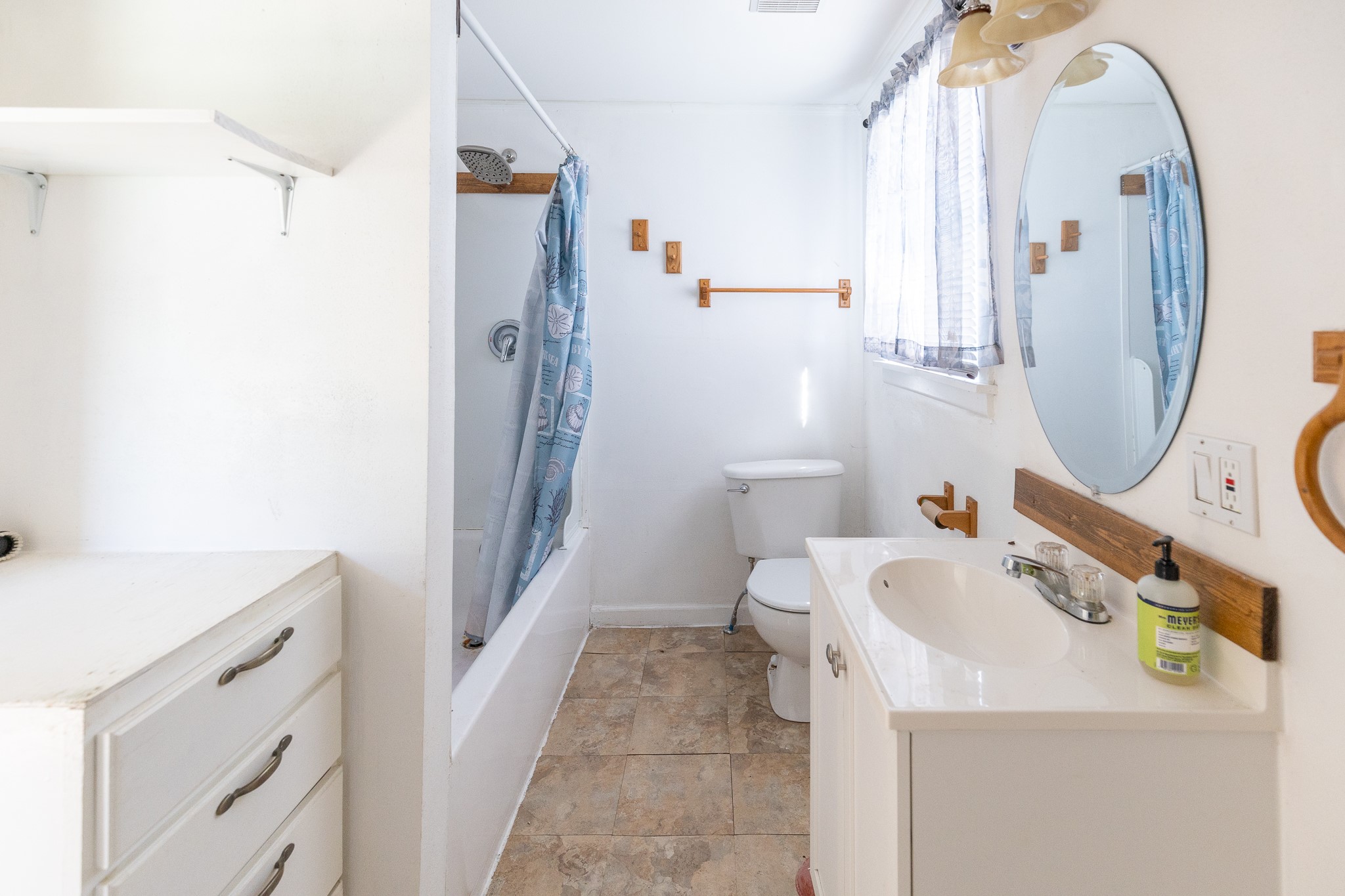 1425 15th Street Huntsville, TX 77340 - Photo 29 of 50 a bathroom with a sink a toilet and shower