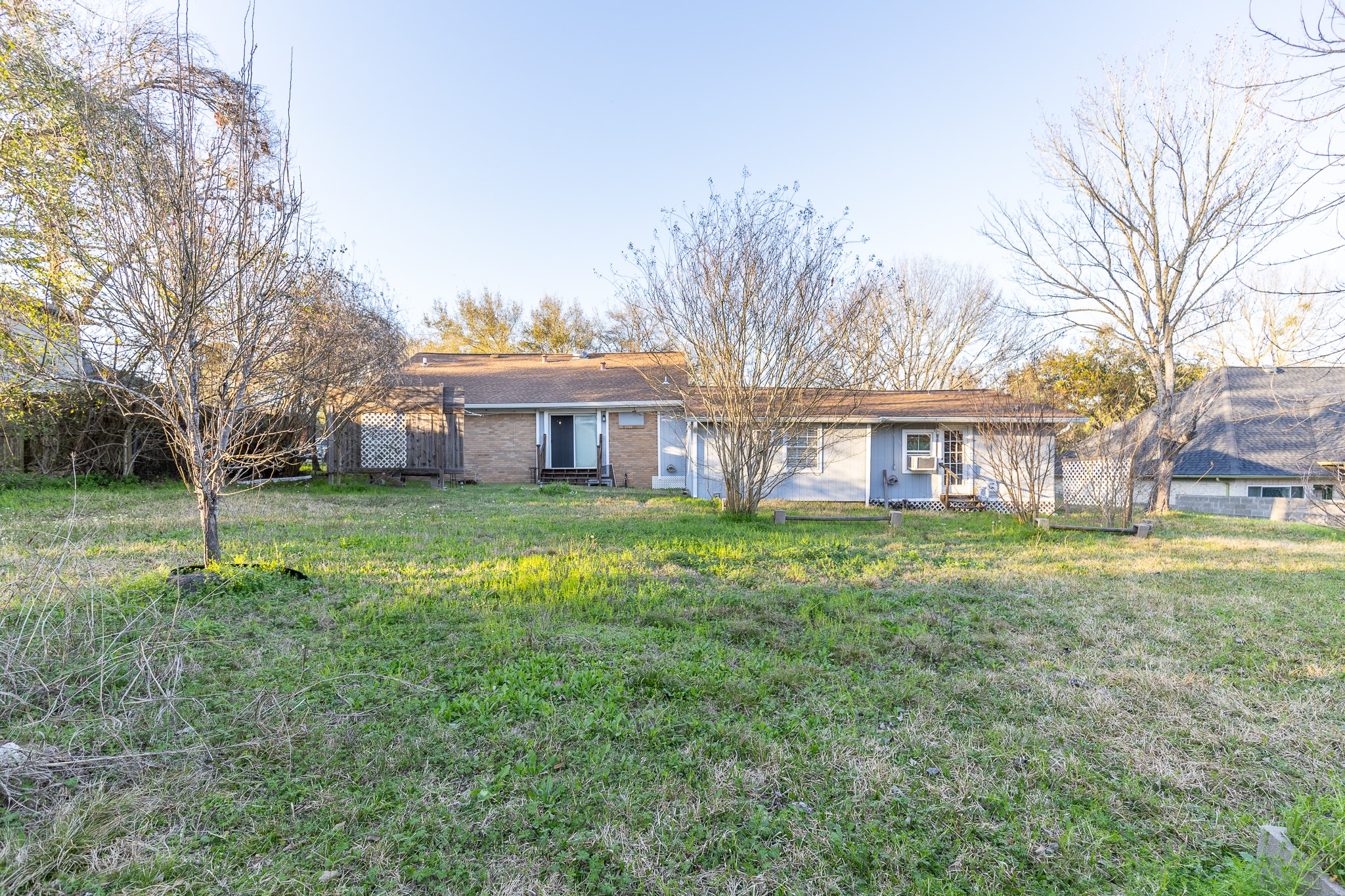 1425 15th Street Huntsville, TX 77340 - Photo 34 of 50 a front view of a house with a yard