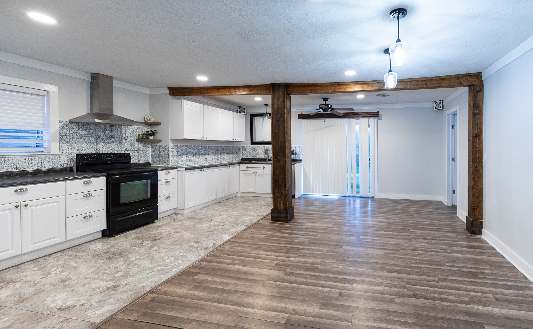 1425 15th Street Huntsville, TX 77340 - Photo 7 of 50 a large kitchen with stainless steel appliances granite countertop a stove and a refrigerator
