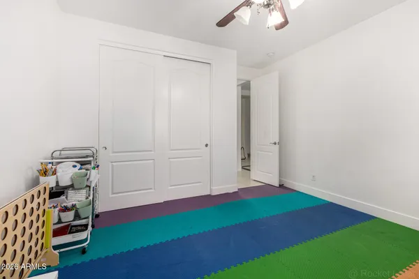 a view of hallway with stairs and wooden floor
