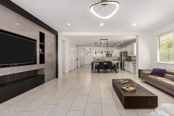 a living room with furniture and a large window