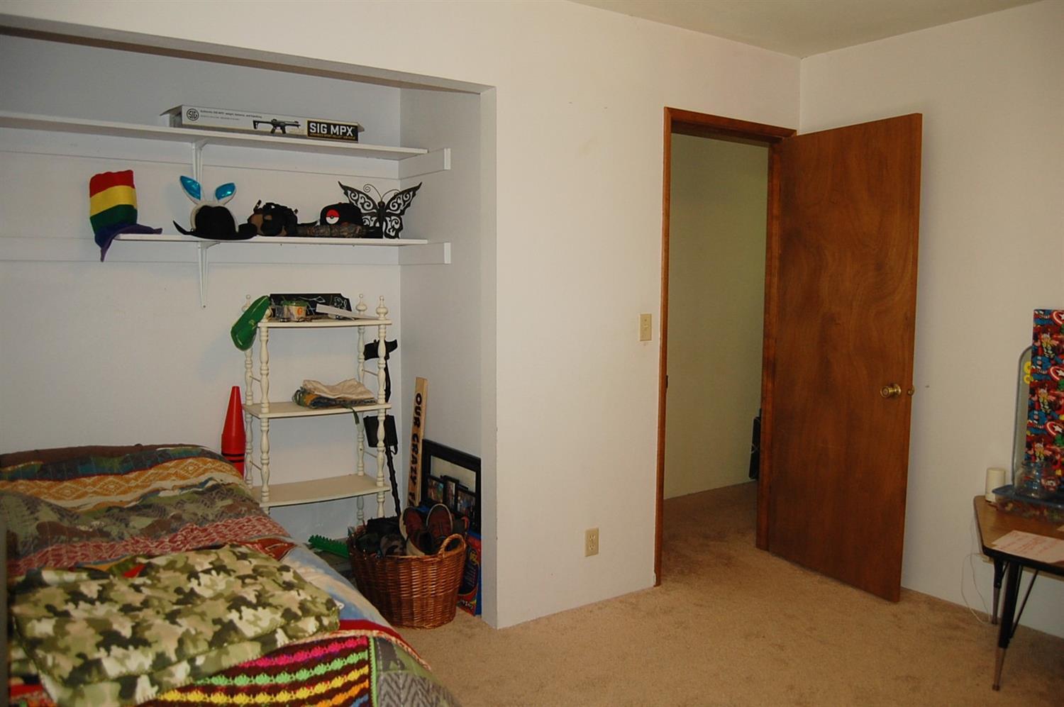 12221 Galice Road Merlin, OR 97532 - Photo 19 of 35 a bedroom with a bed and a dresser in it