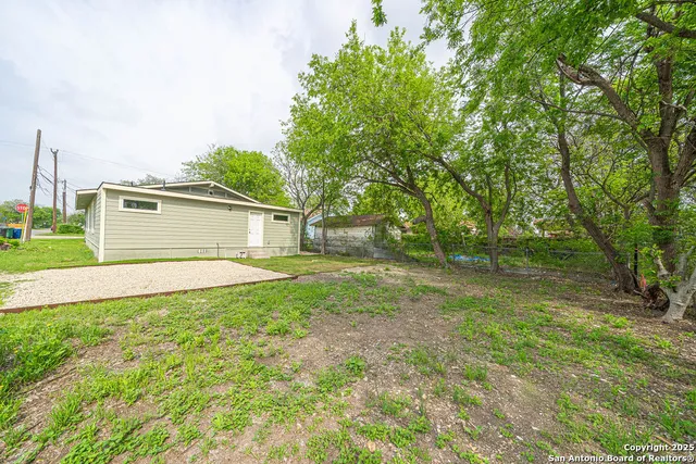 a view of backyard with green space