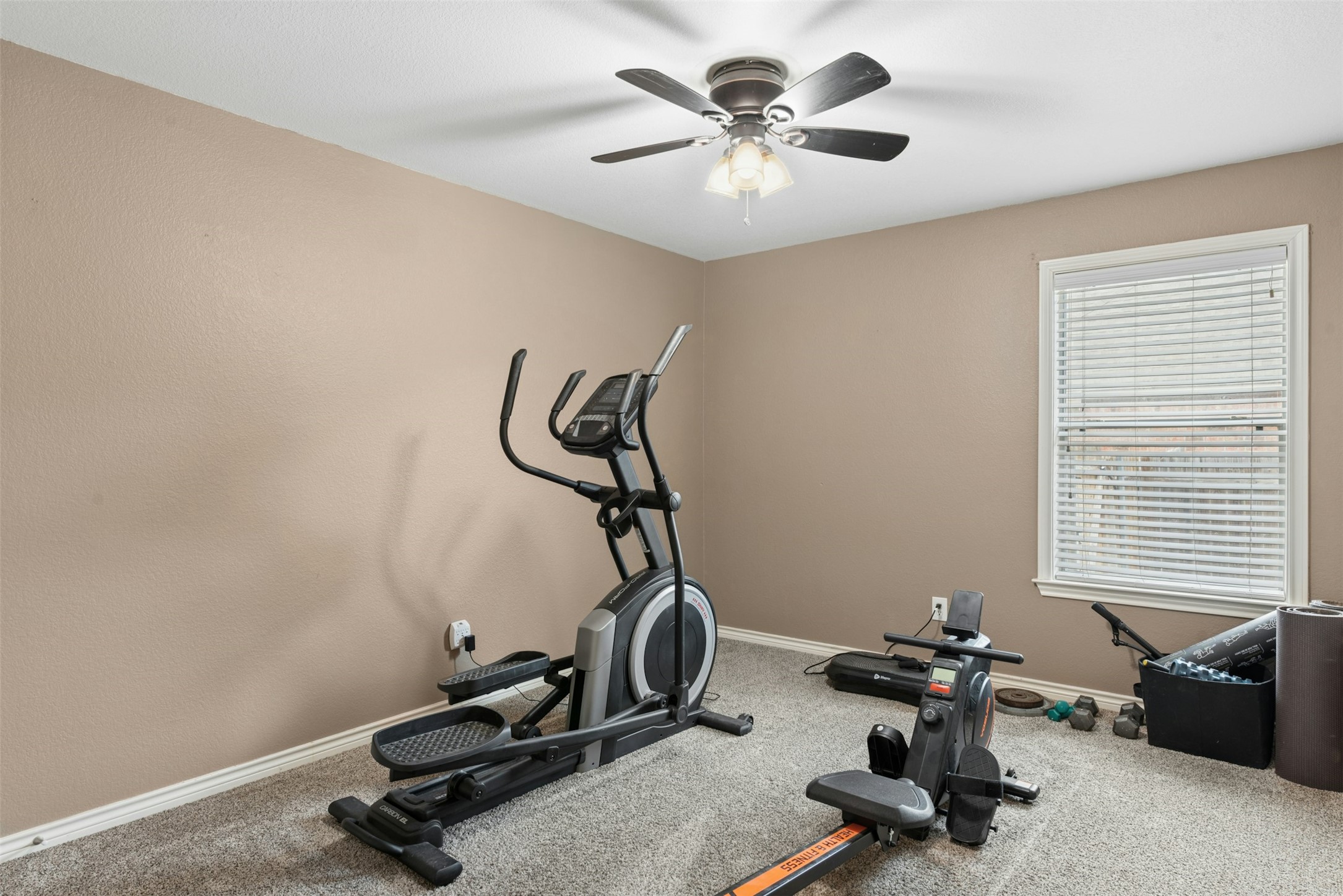 30013 Edgewood Drive Georgetown, TX 78628 - Photo 24 of 39 Bedroom 2 is being used as an exercise room. Could also be a home office.
