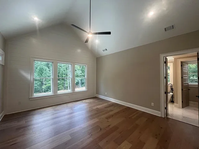 a bathroom with a sink mirror and toilet