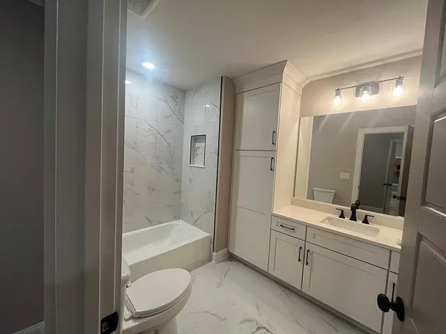 a kitchen with a sink cabinets and window