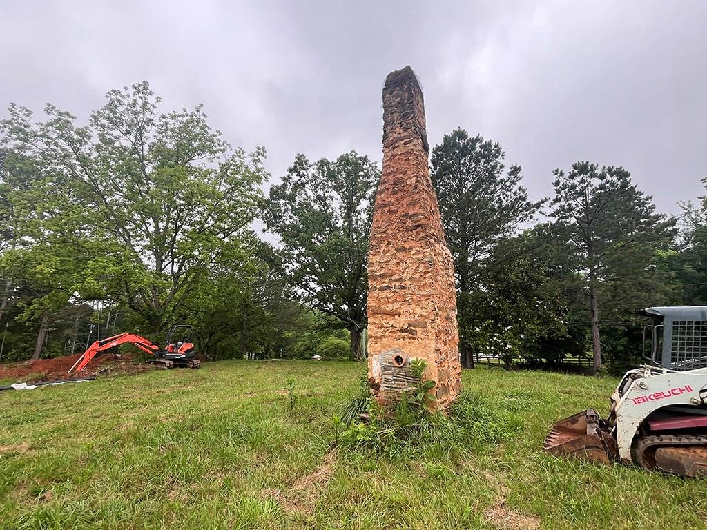 2226 Upper Burris Road Ball Ground, GA 30107 - Photo 61 of 65 a front view of a house with a yard and garage