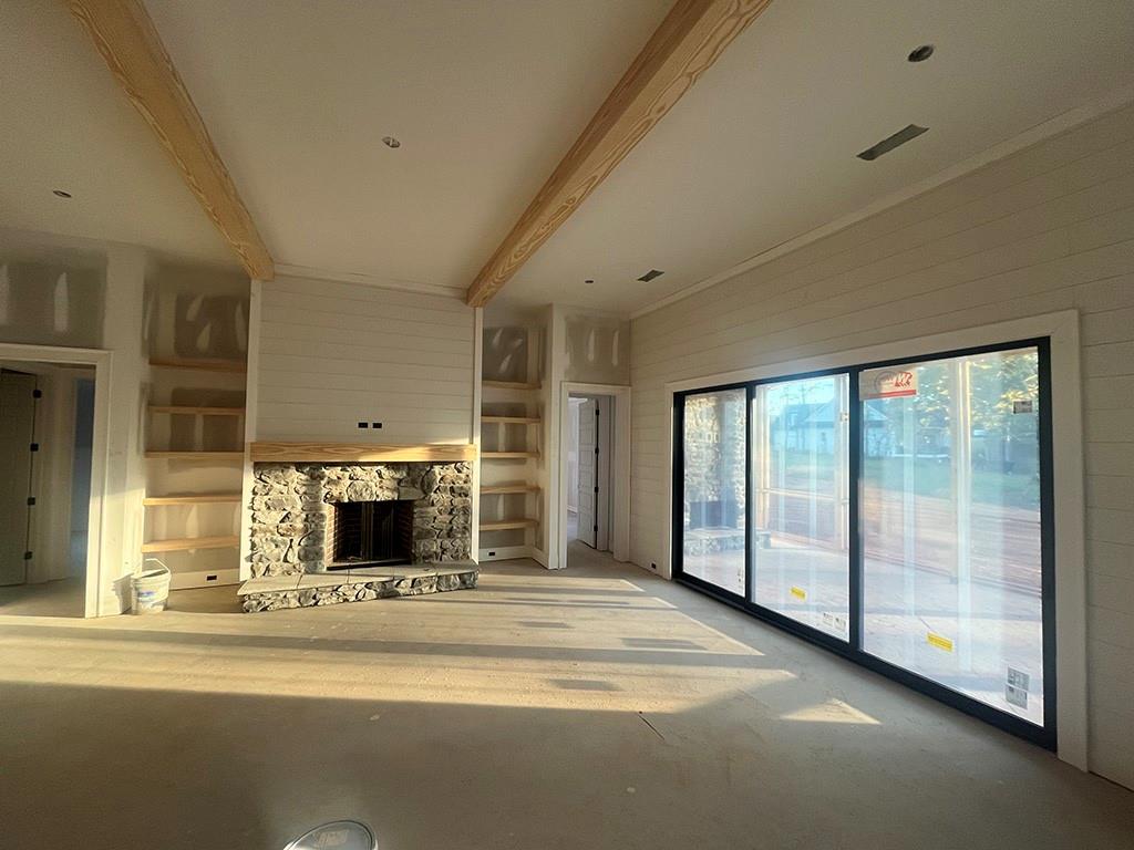 2226 Upper Burris Road Ball Ground, GA 30107 - Photo 10 of 65 a view of an empty room with a fireplace and a window