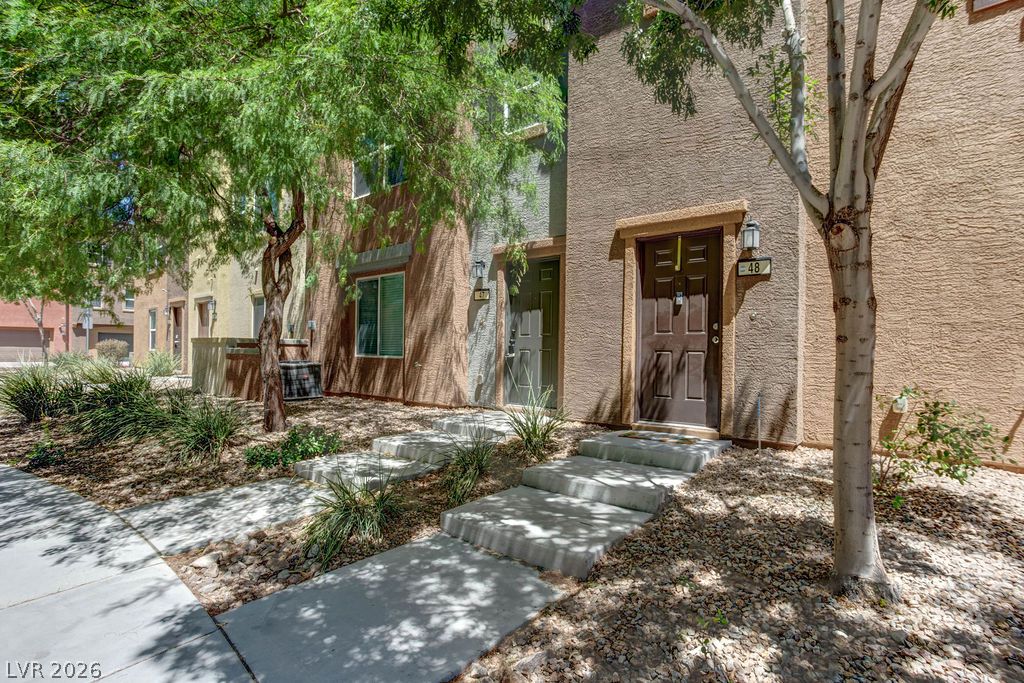 4650 Ranch House Road, Unit 47 North Las Vegas, NV 89031 - Photo 37 of 43 A welcoming path leads to the private entry of this well-maintained residence.