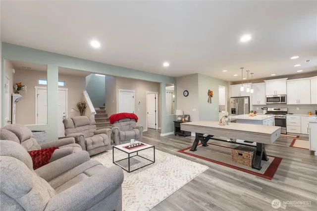 a living room with furniture and a table
