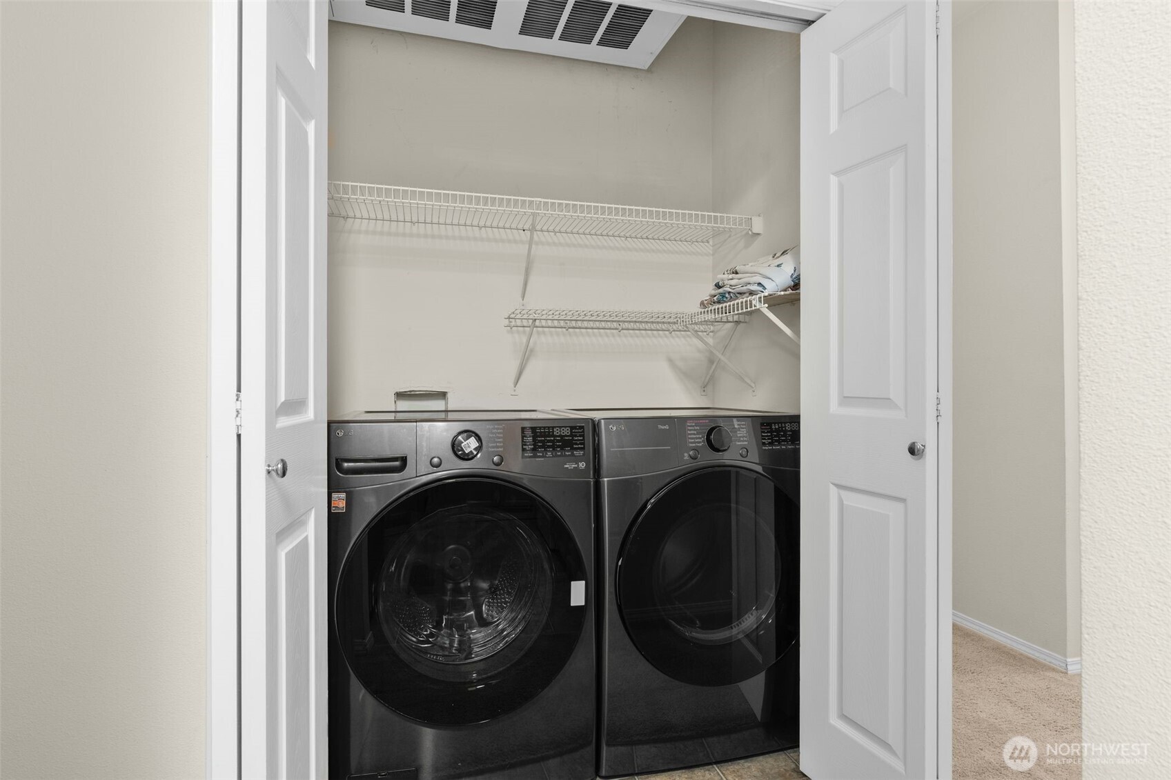 12120 Northeast 172nd Place, Unit L201 Bothell, WA 98011 - Photo 13 of 35 a utility room with dryer and washer