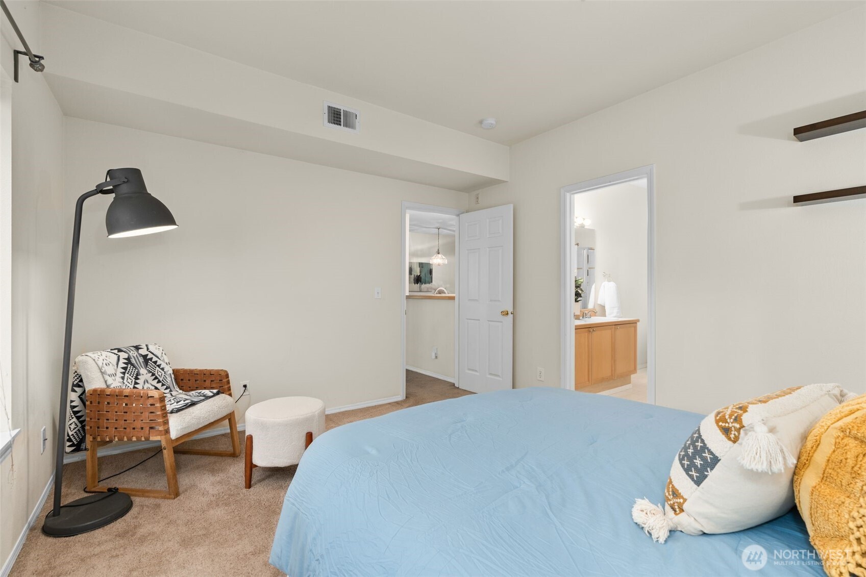 12120 Northeast 172nd Place, Unit L201 Bothell, WA 98011 - Photo 15 of 35 a bedroom with bed and a window