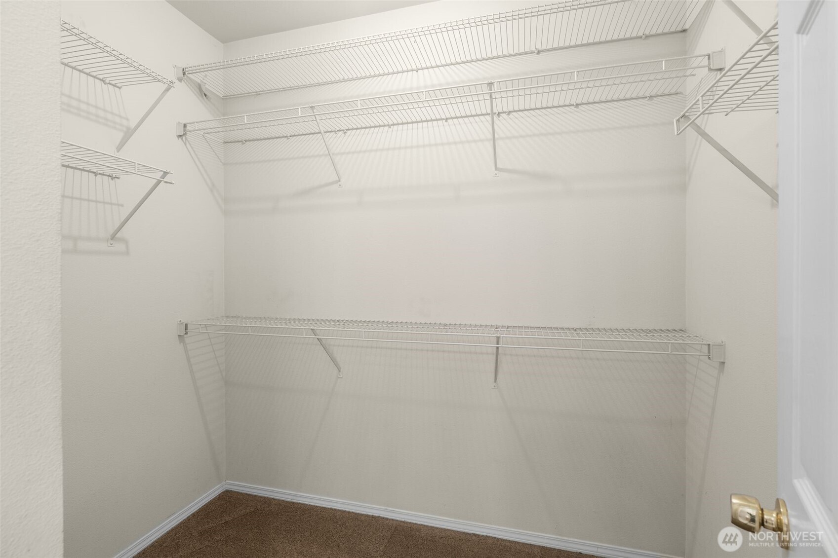 12120 Northeast 172nd Place, Unit L201 Bothell, WA 98011 - Photo 18 of 35 a view of a room with racks on the wall