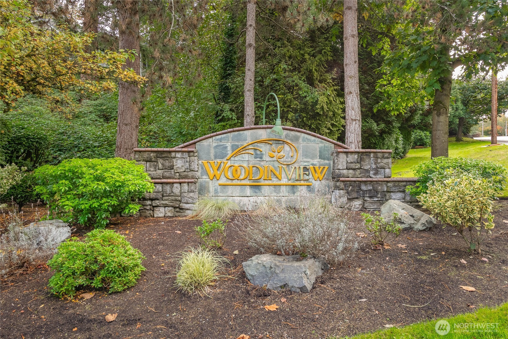 12120 Northeast 172nd Place, Unit L201 Bothell, WA 98011 - Photo 32 of 35 a view of swimming pool with a yard