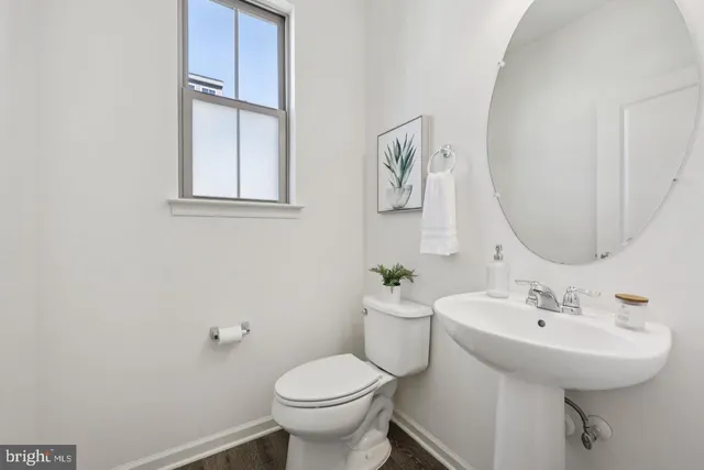 a bedroom with a large bed couch and a window