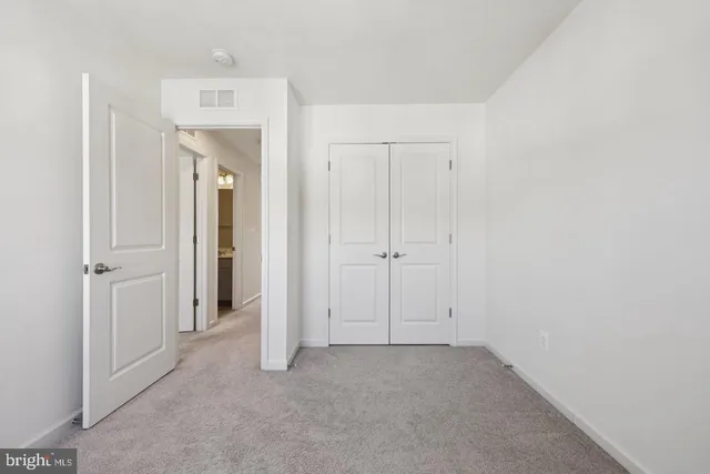 a view of a balcony with wooden floor