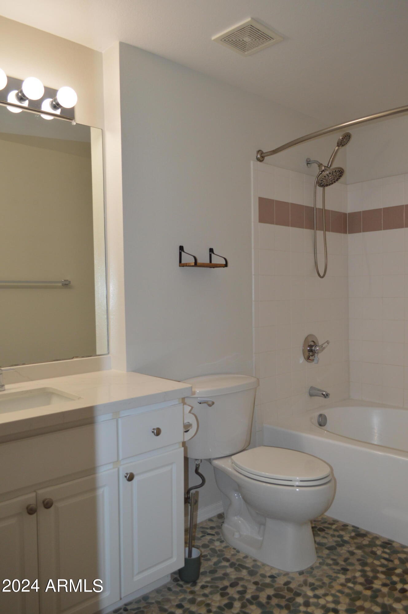 1701 East Colter Street, Unit 263 Phoenix, AZ 85016 - Photo 15 of 65 a bathroom with a toilet a sink and bathtub