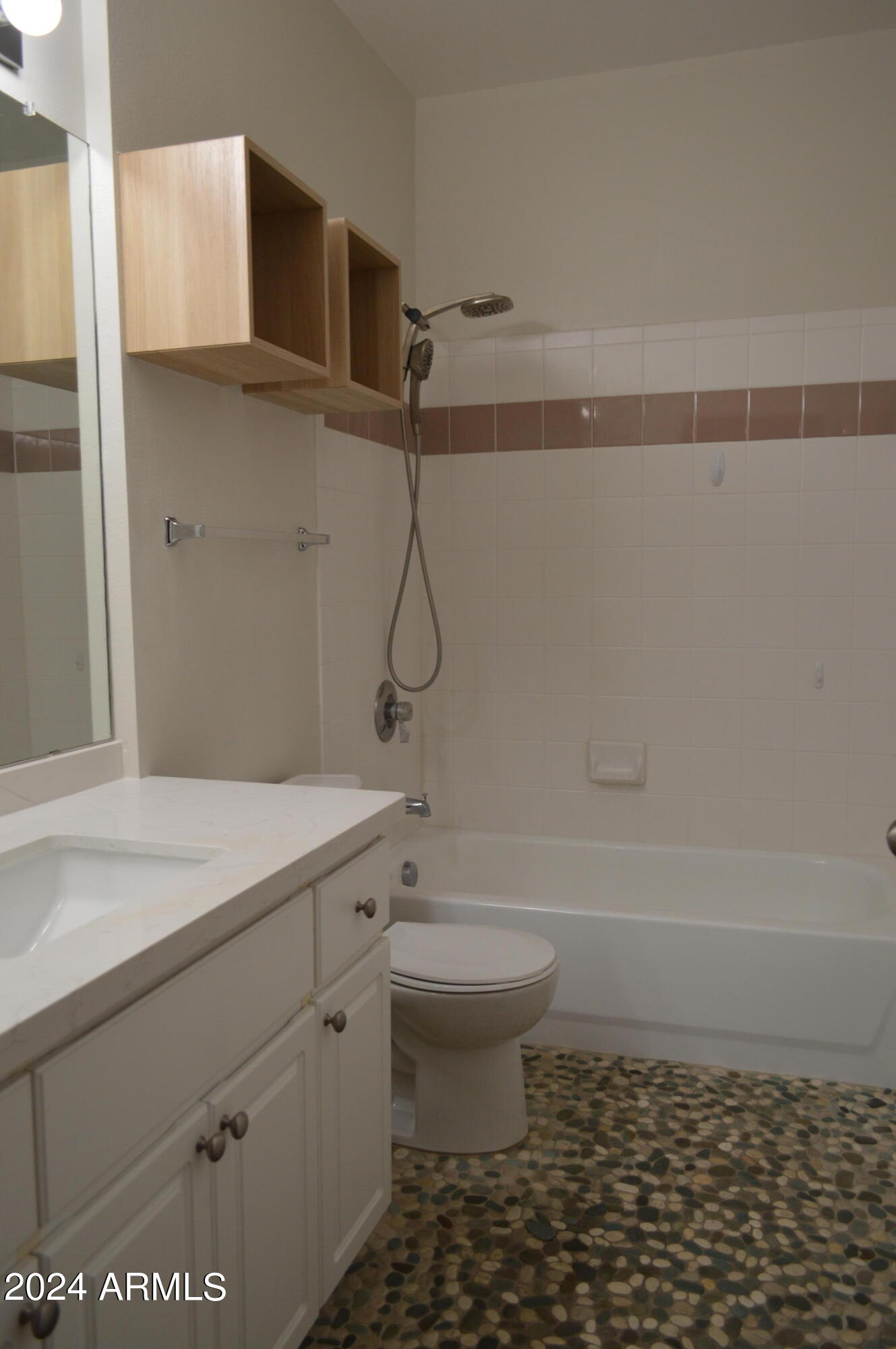 1701 East Colter Street, Unit 263 Phoenix, AZ 85016 - Photo 18 of 65 a bathroom with a granite countertop sink a toilet and shower