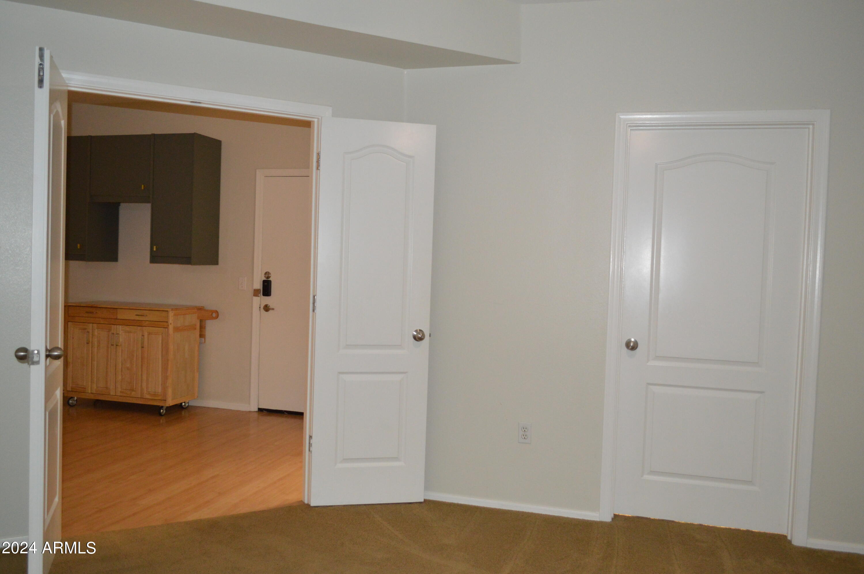 1701 East Colter Street, Unit 263 Phoenix, AZ 85016 - Photo 19 of 65 a view of a livingroom with an empty space and a bathroom