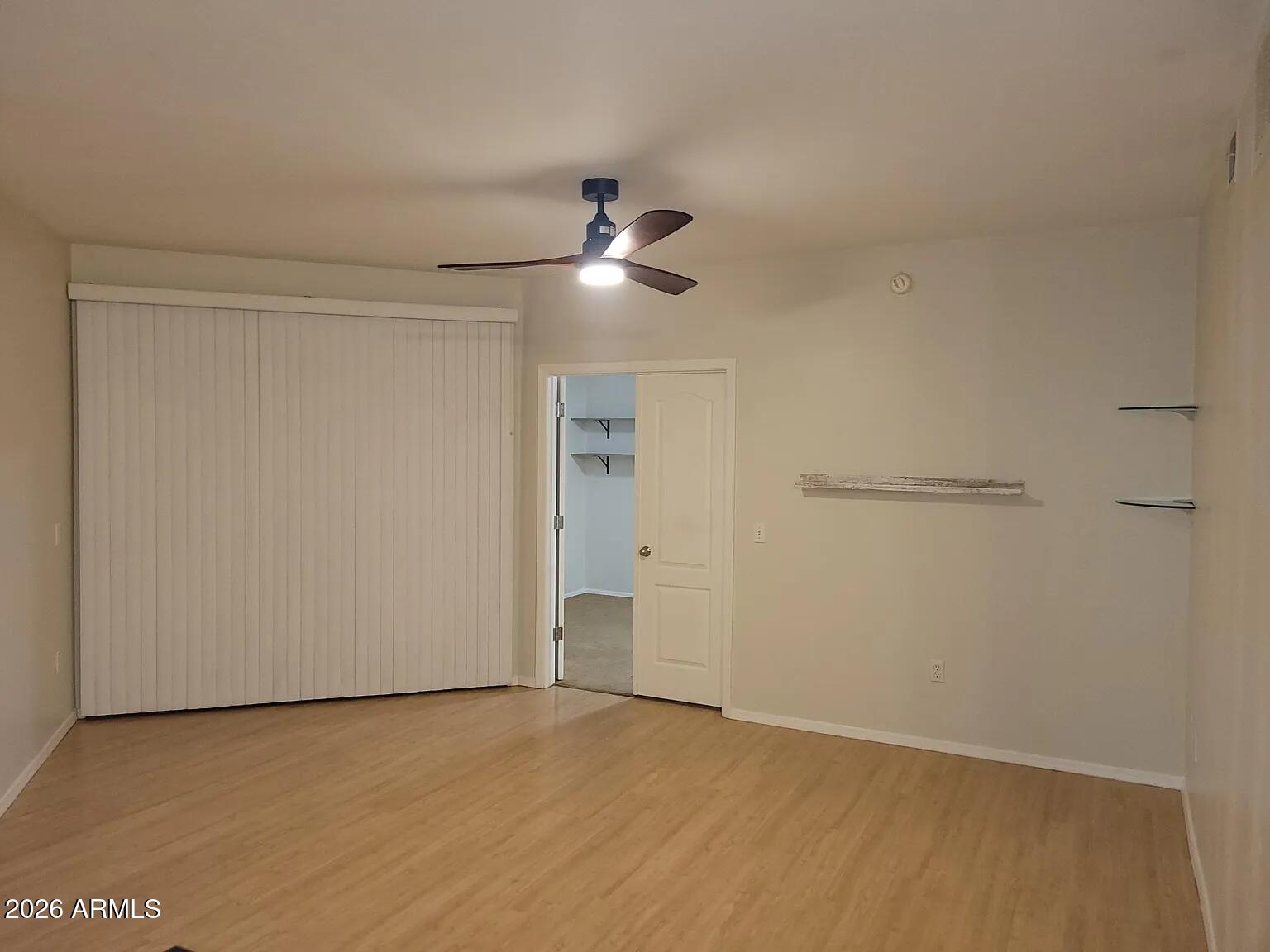 1701 East Colter Street, Unit 263 Phoenix, AZ 85016 - Photo 22 of 65 a view of an empty room and chandelier fan