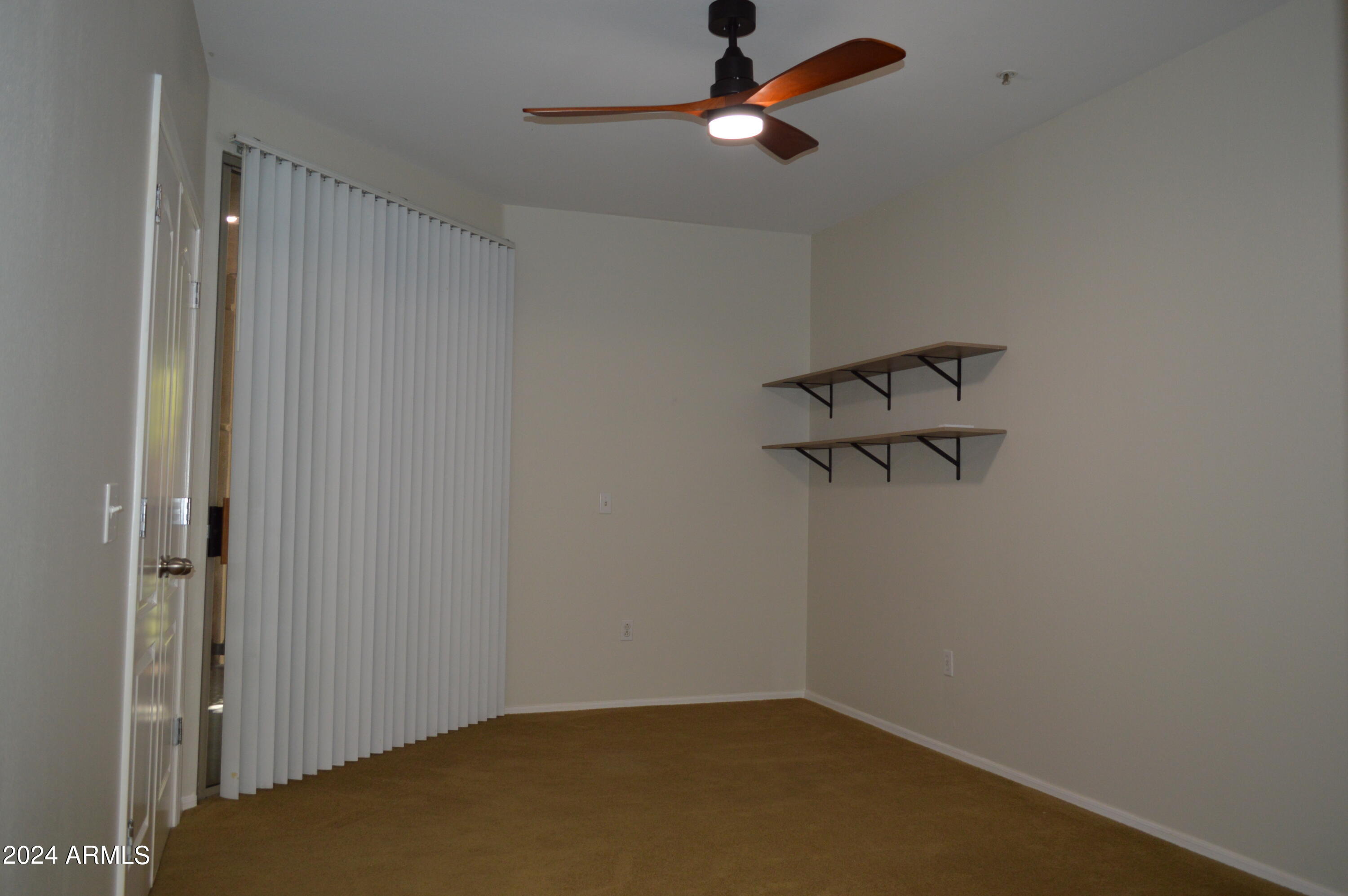 1701 East Colter Street, Unit 263 Phoenix, AZ 85016 - Photo 23 of 65 a view of a room with rack on the wall