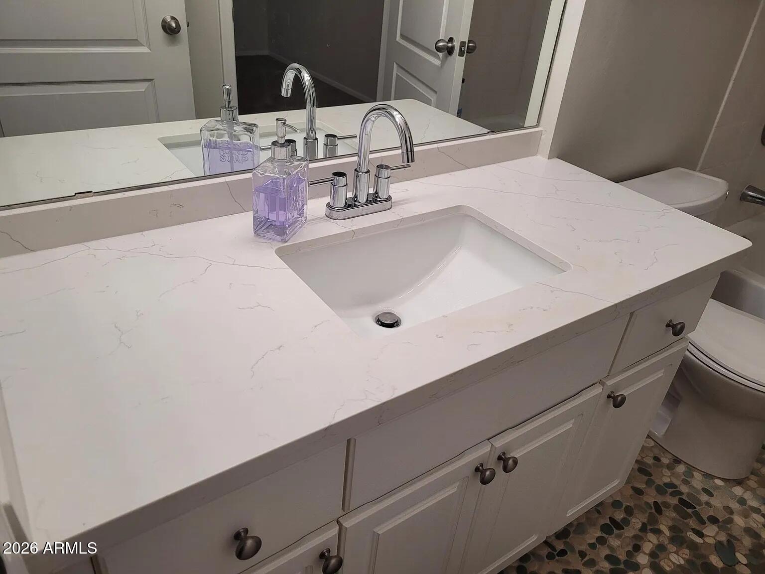 1701 East Colter Street, Unit 263 Phoenix, AZ 85016 - Photo 27 of 65 a bathroom with a sink and a mirror